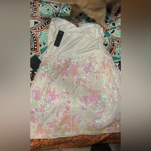 White backless sequin dress. Unworn just missed the return time.